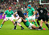 Brodie Retallick is tackled by James Lowe during Ireland v New Zealand quarter final at 2023 Rugby World Cup