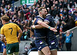 Byron McGuigan celebrates scoring Scotland's first try against Australia