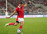 Dan Biggar kicks the ball during Wales v Fiji match in 2023 Rugby World Cup