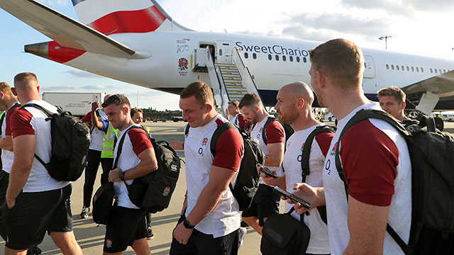 England players prepare to board the plane to Japan