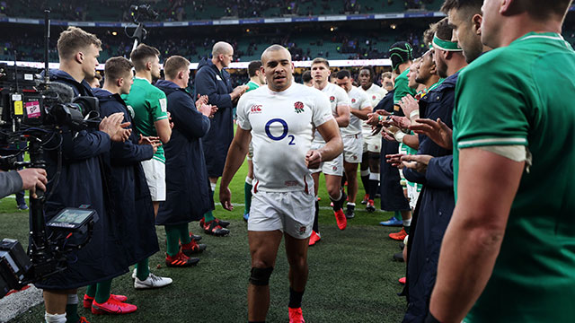 England players walk past Ireland players in 2020 Six Nations