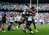 Fiji players celebrate victory over England at Twickenham in 2023 summer internationals