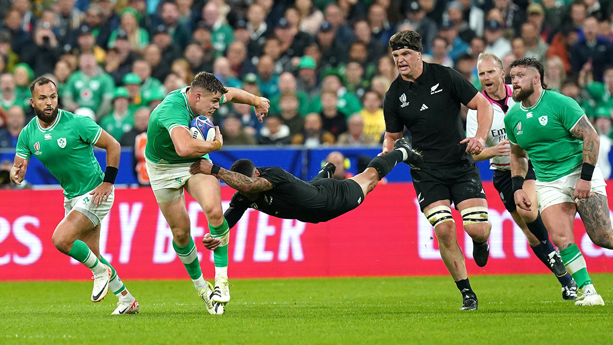 Garry Ringrose is tackled during Irelnd v New Zealand quarter final at 2023 Rugby World Cup