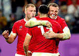Hadleigh Parkes, Owen Watkin and Ross Moriarty celebrate after the final whistle in Wales v France quarter final