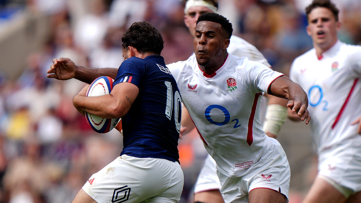 Immanuel Feyi-Waboso tackles Antoine Hastoy during the England XV v France XV match before 2025 Summer tour