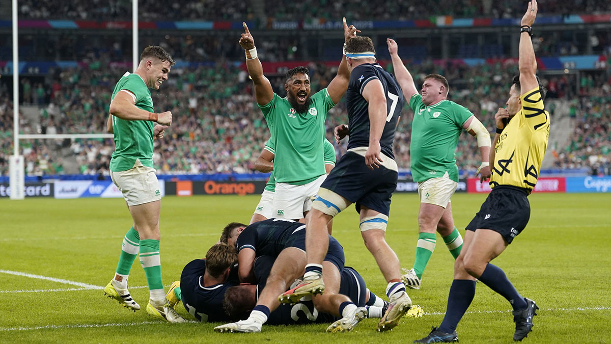 Ireland players celebrate scoring a try against Scotland at 2023 Rugby World Cup