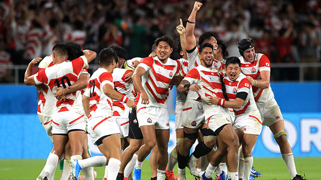 Japan players celebrate a famous victory over Ireland at World Cup