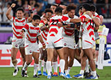 Japan players celebrate at the final whistle after beating Scotland at World Cup