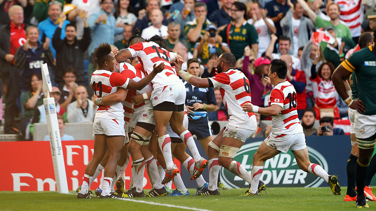 Japan players celebrate victory over South Africa during 2015 Rugby World Cup