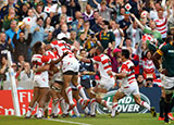 Japan players celebrate victory over South Africa during 2015 Rugby World Cup