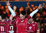 Joe Roberts celebrates a victory with the Scarlets