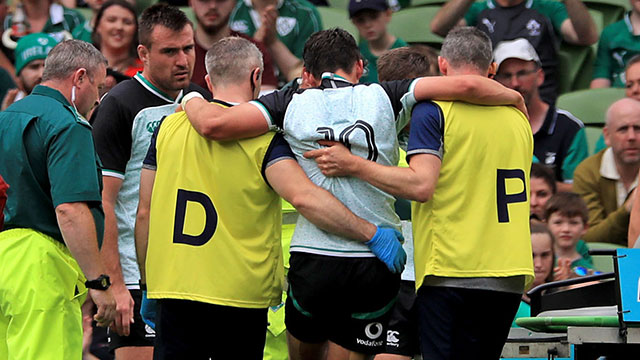 Joey Carbery leaves the field injured during the Ireland v Italy match