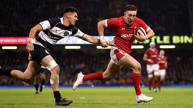 Josh Adams goes through to score a try for Wales v Barbarians