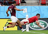 Josh Adams scores a try for Wales v Georgia in World Cup