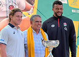 Michael Hooper, Mark Ella and Courtney Lawes stand with the Ella Mobbs Cup
