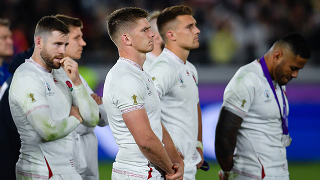 Owen Farrell and England players watch South Africa lift Webb Ellis cup