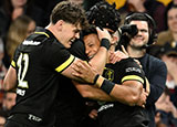 Regan Grace is congratulated by team mates after scoring a try for Wales v Queensland Reds during 2024 summer internationals