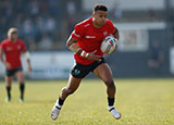 Regan Grace runs with the ball while representing St Helens