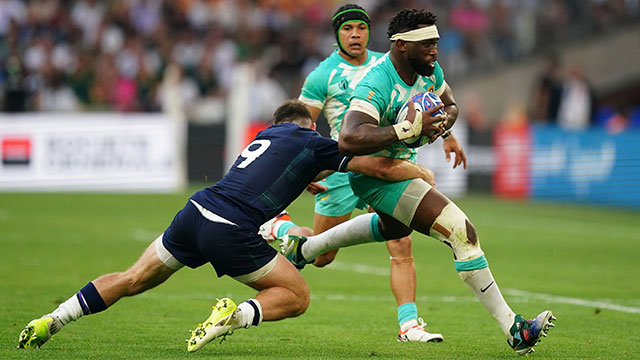 Siya Kolisi is tackled by Ben White during South Africa v Scotland match in 2023 Rugby World Cup