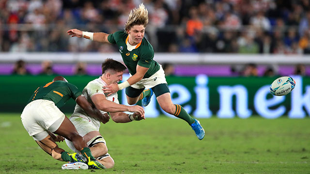 Tom Curry is challenged by South Africas Faf de Klerk