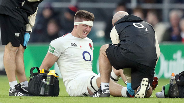 Tom Curry receives treatment during the England v South Africa match