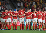 Wales players gather in circle after beating Australia at World Cup